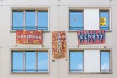 Banner am Haus: genossen-schafft-sldrtt